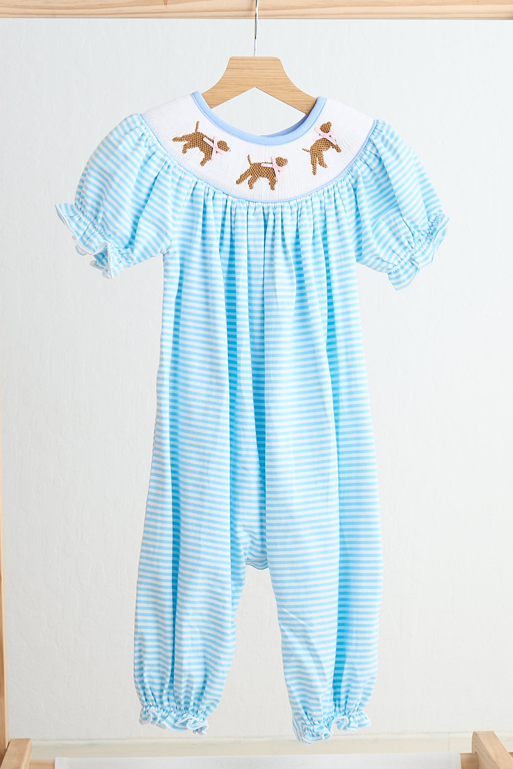 Blue puppy hand smocked girl romper