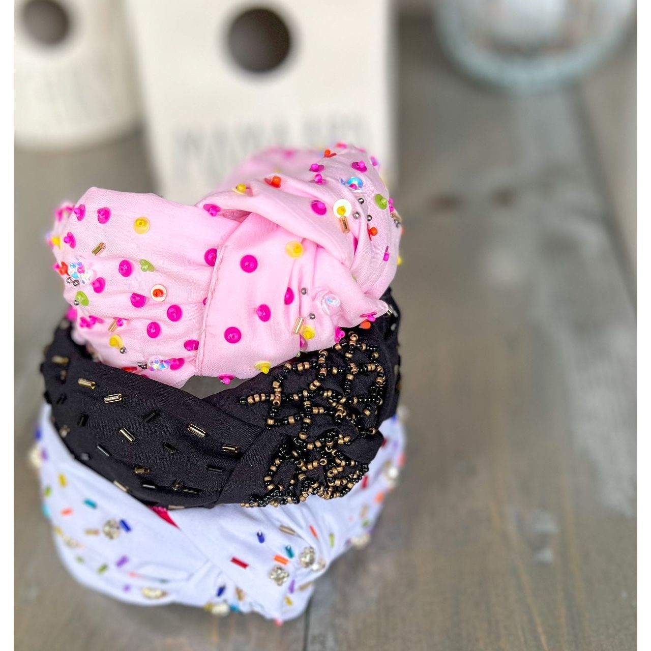 Confetti Beaded Top Knot Headband in Pink, Black and Gold, and White Multi-Colors.